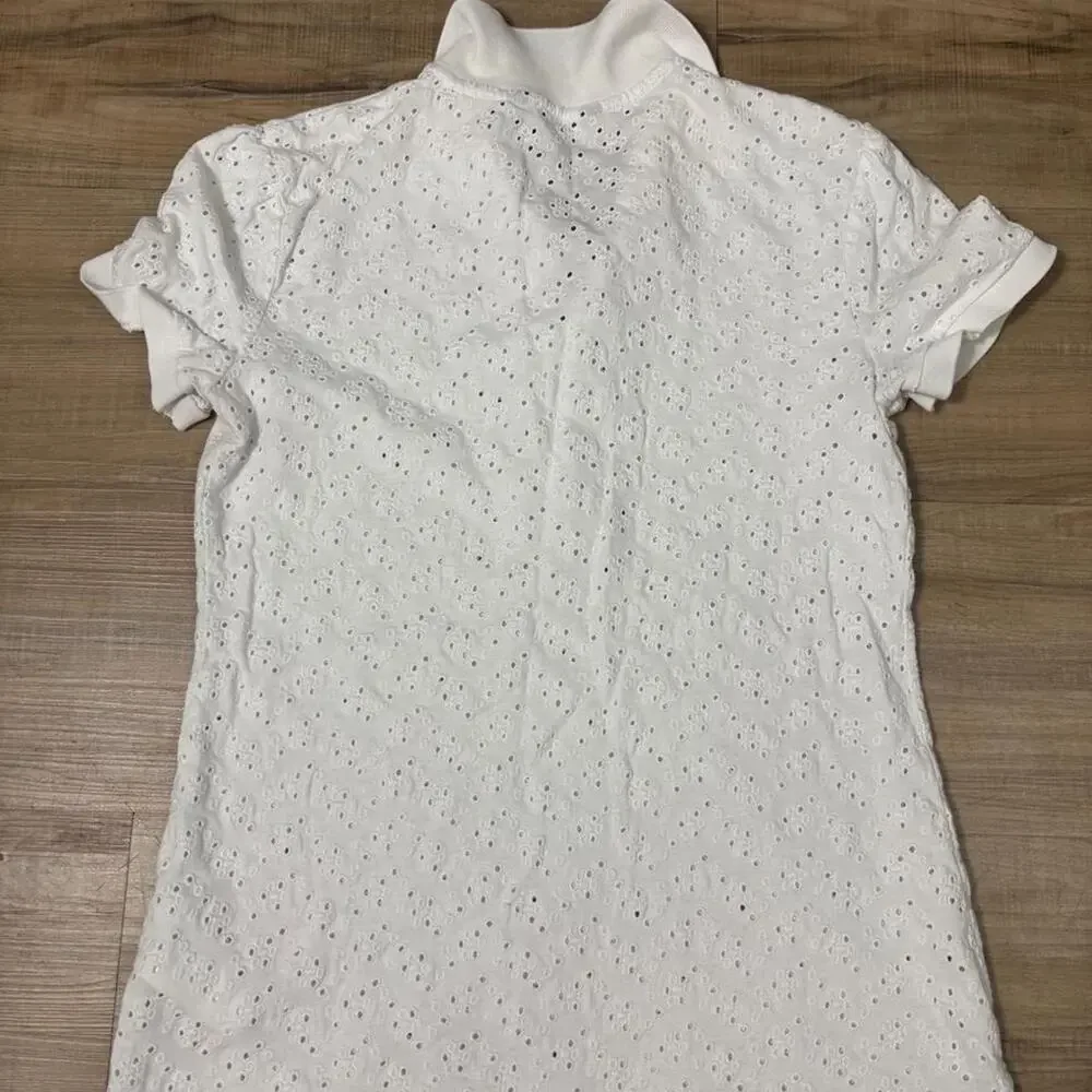 White eyelet polo top with
